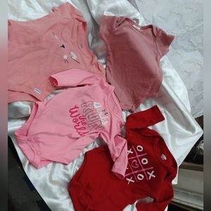 Red and pink onesies 3 to 6 months